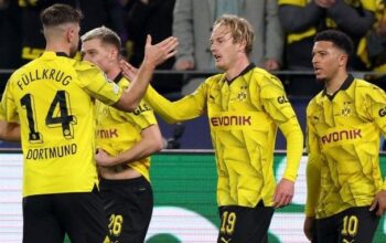 Dortmund edge Atletico in thriller to reach semis